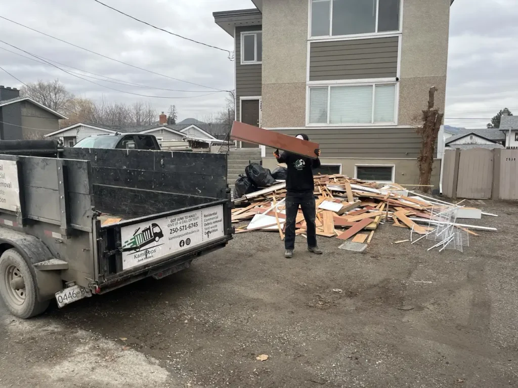 Kamloops junk removal crew loading old furniture and large items into a truck