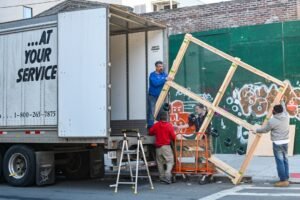 licensed junk removal Kamloops truck with crew loading household items responsibly