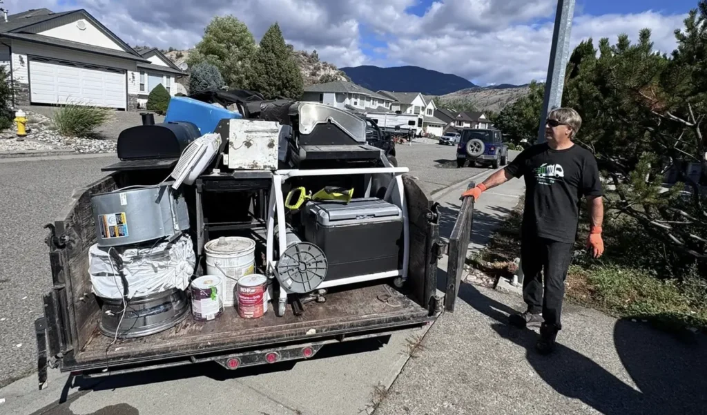 Household junk and paint cans being sorted for proper disposal during a Kamloops cleanout